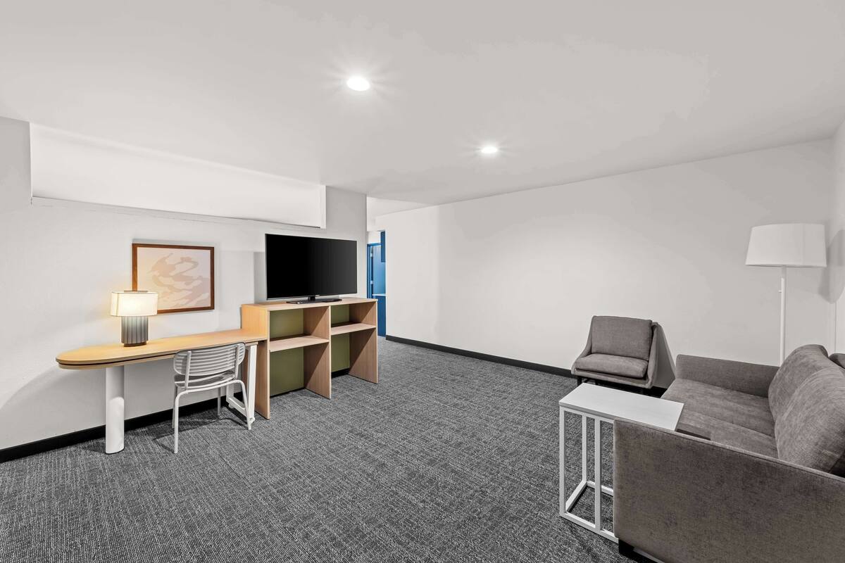 suite, 1 king bed | desk, blackout curtains, iron/ironing board, free wifi