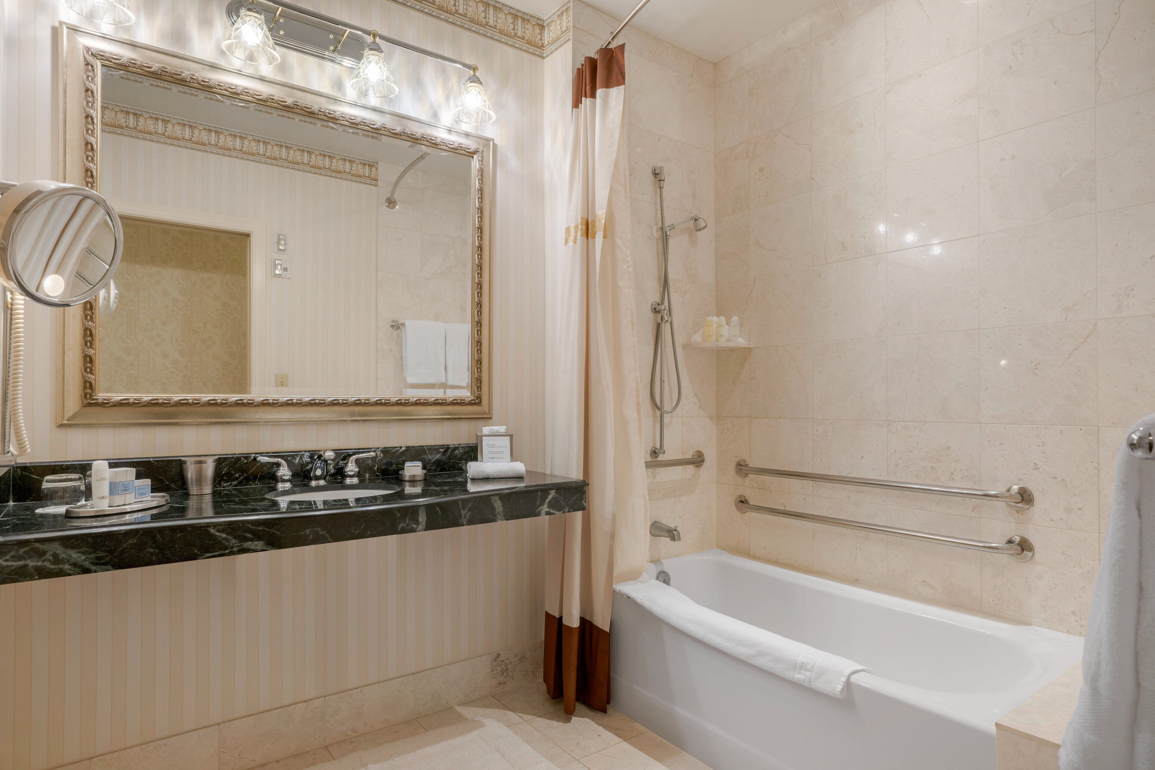 combined shower/bathtub, designer toiletries, hair dryer, bathrobes