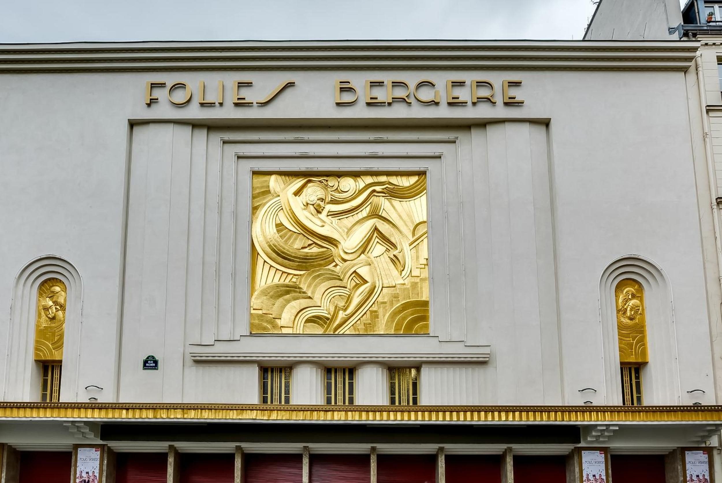 A building facade with the inscription 'FOLIES BERGER' and a central golden relief sculpture.