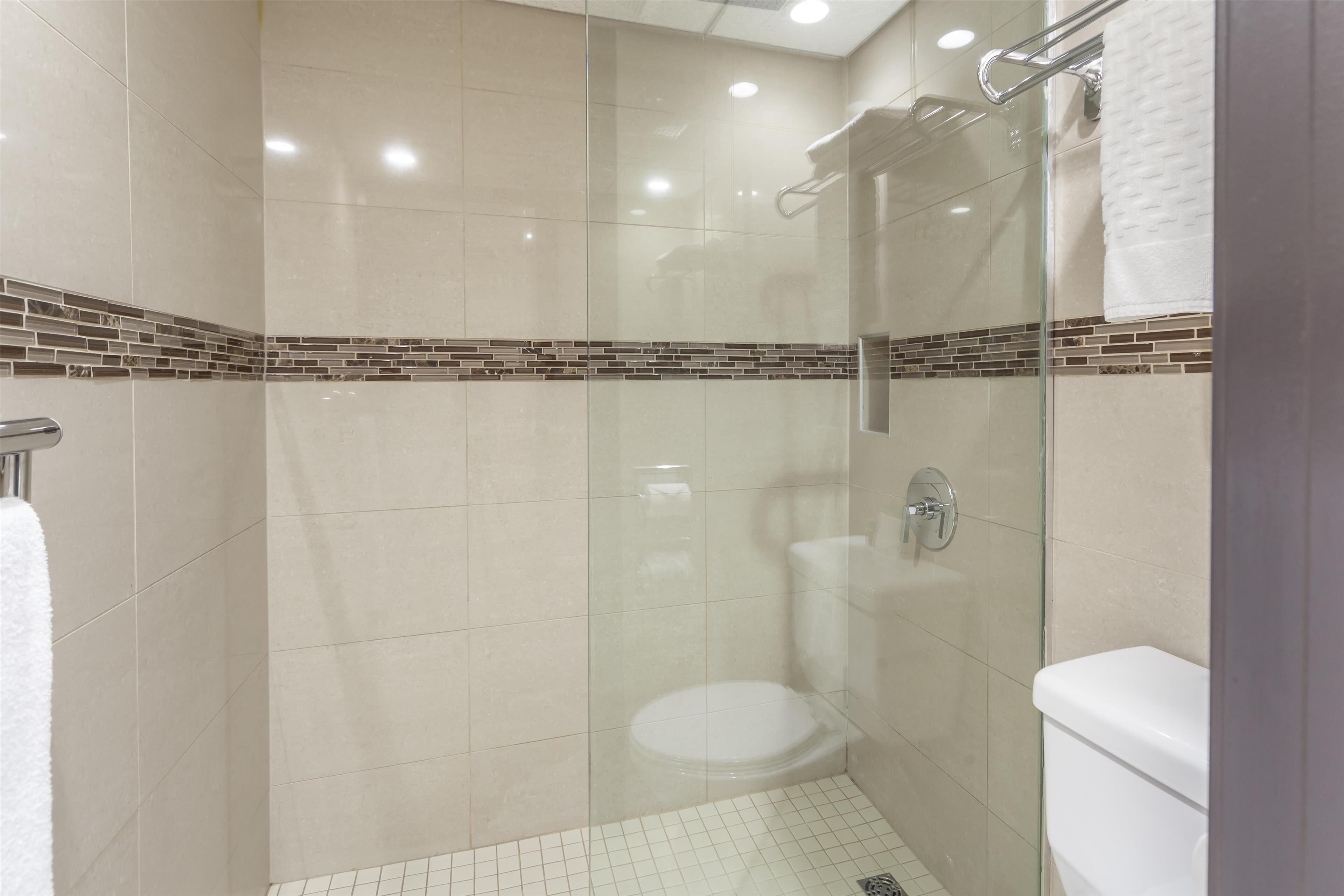 standard room, 1 king bed, non smoking, refrigerator & microwave | bathroom | shower, free toiletries, hair dryer, bathrobes