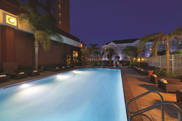 Outdoor pool, open 7:00 AM to midnight, pool loungers