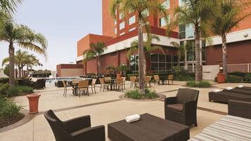 Outdoor pool, open 7:00 AM to midnight, pool loungers