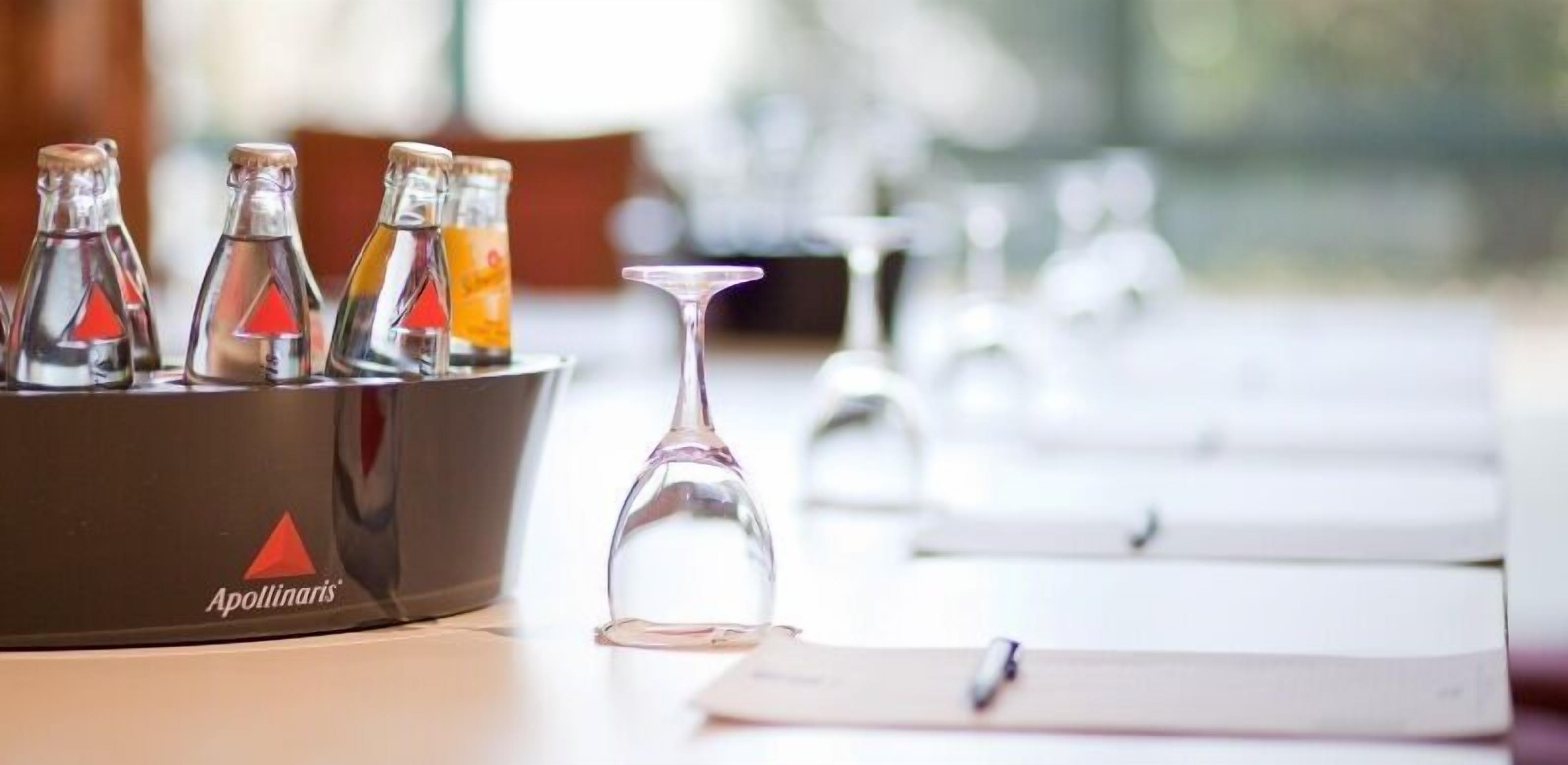 A laboratory setup with glassware and a notebook on a table.