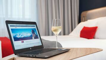 Desk, laptop workspace, blackout drapes, iron/ironing board