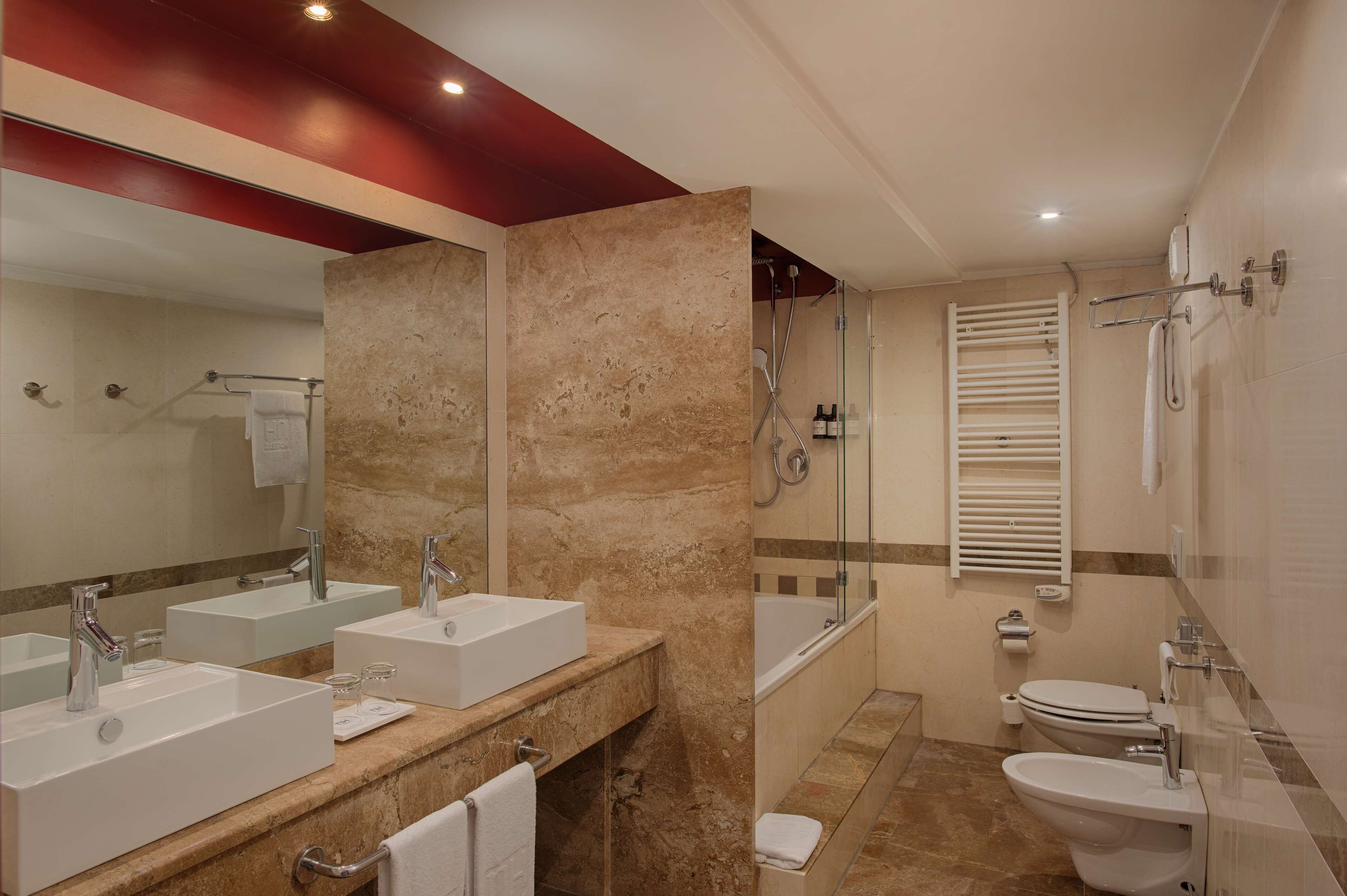 superior room (view) | bathroom | shower, designer toiletries, hair dryer, towels