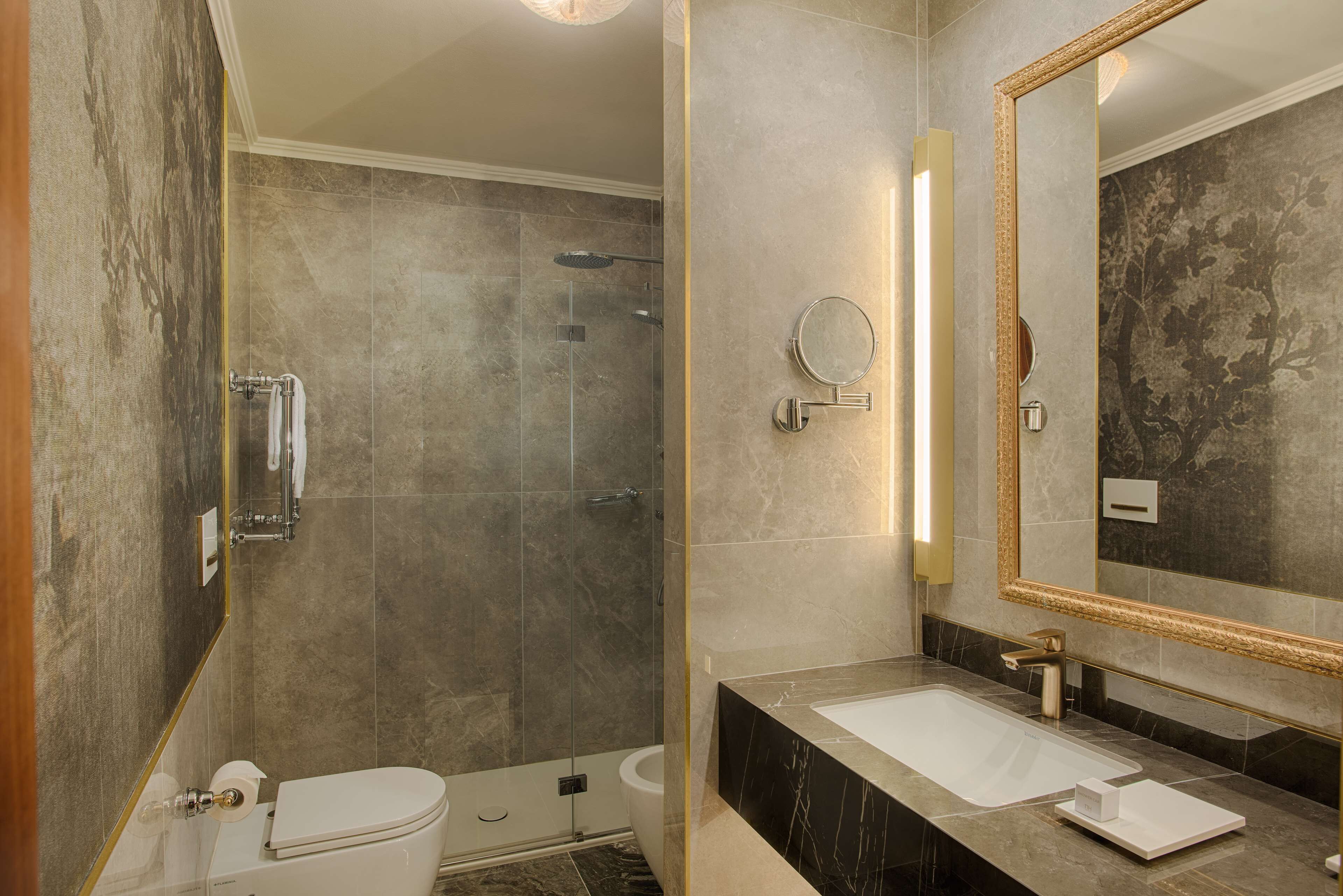 premium room with canal view | bathroom | shower, designer toiletries, hair dryer, towels