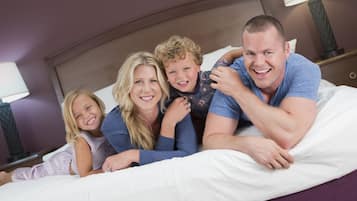 Family enjoys a restful night's sleep in this inviting room with a comfortable bed and cozy ambiance.