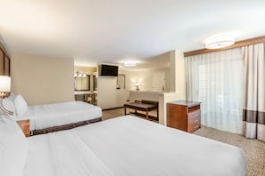 A hotel room with two beds, a desk, a chair, a dresser, a mirror, and a television. - Comfort Suites Red Bluff near I-5 (Red Bluff)