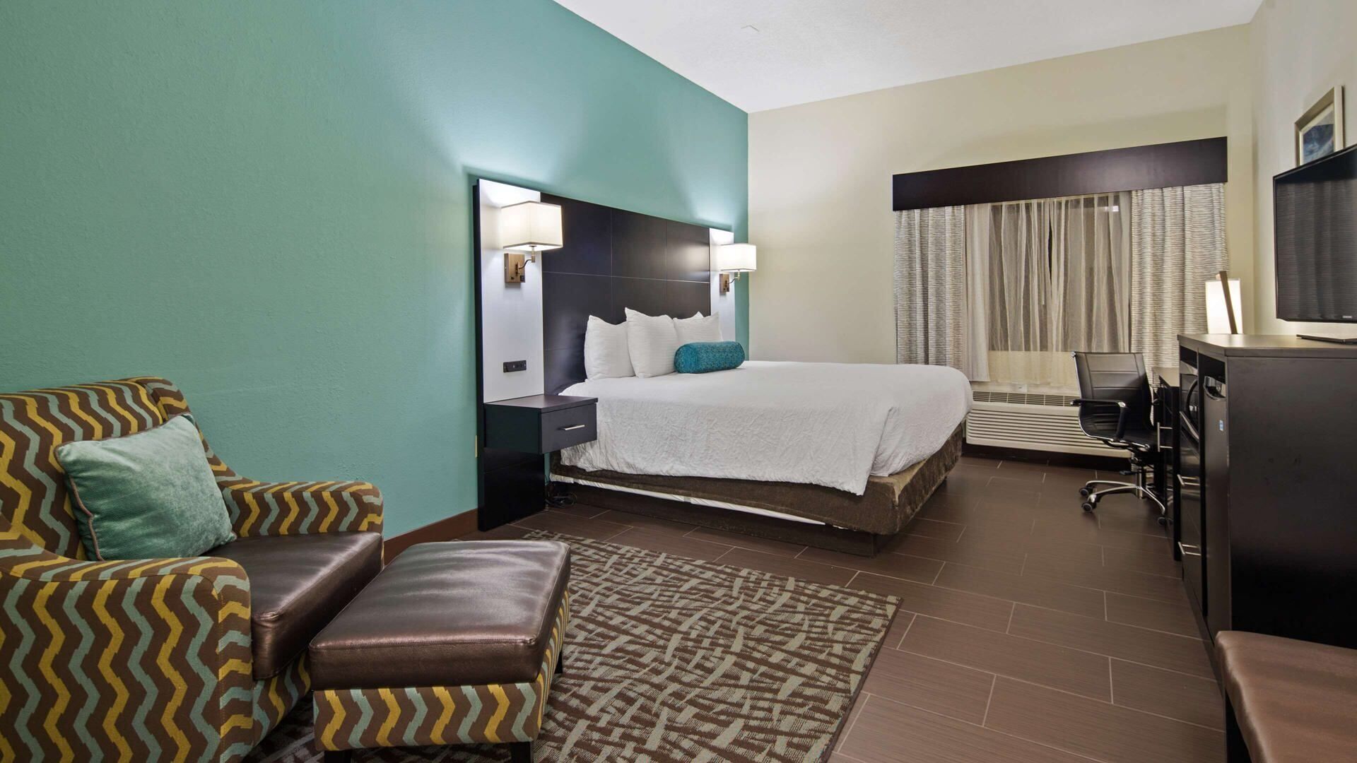 Premium bedding, desk, laptop workspace, blackout curtains