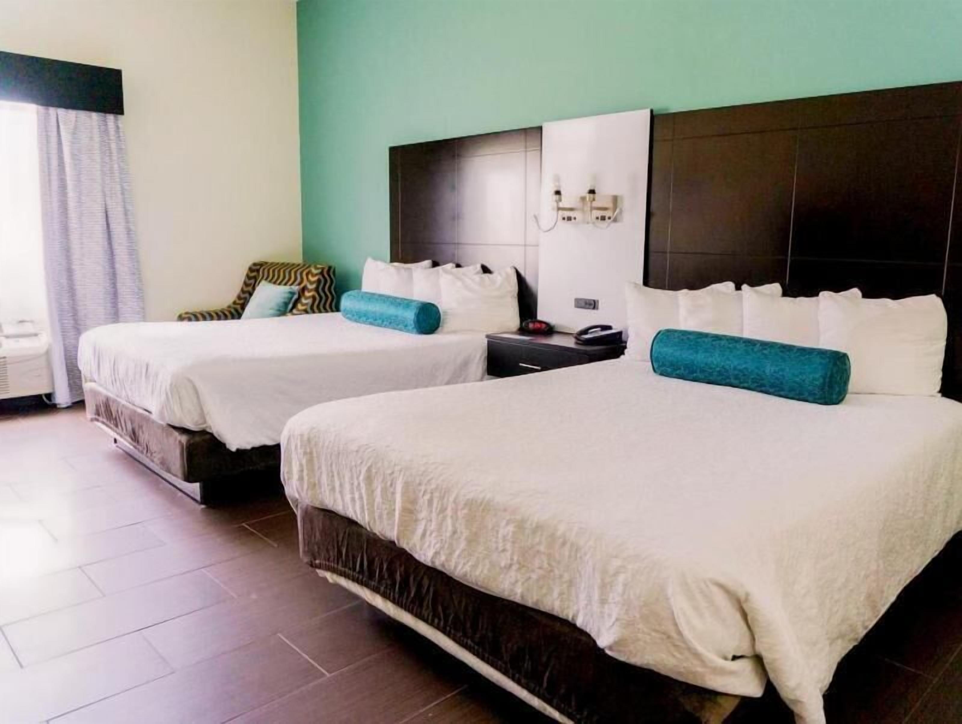 Premium bedding, desk, laptop workspace, blackout curtains