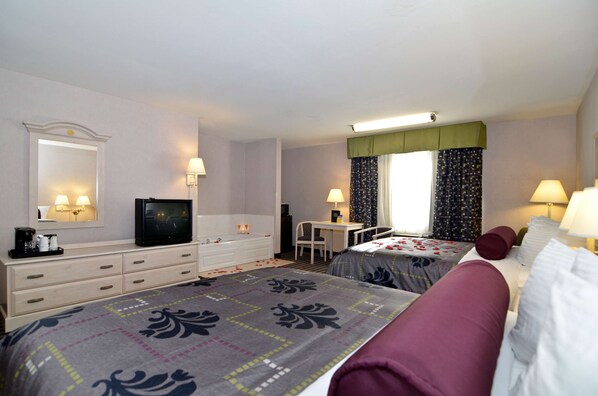 Relax in a cozy space with a double bed, desk, and TV.