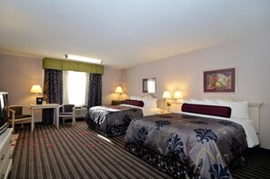 Two single beds with matching headboards and footboards, a flat-screen TV, and a desk with a chair.