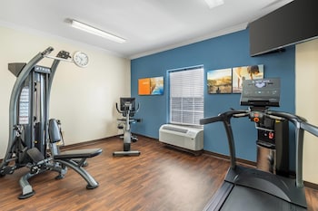 A storage room with shelves stocked with snacks, beverages, and household items. at Comfort Suites Myrtle Beach Central