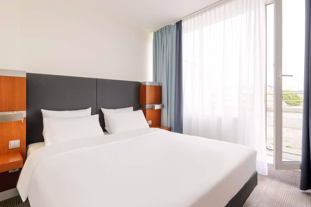 premium bedding, desk, laptop workspace, blackout curtains