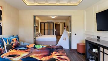 Relax in a stylish room with a large bed, flat-screen TV, and cozy seating area.