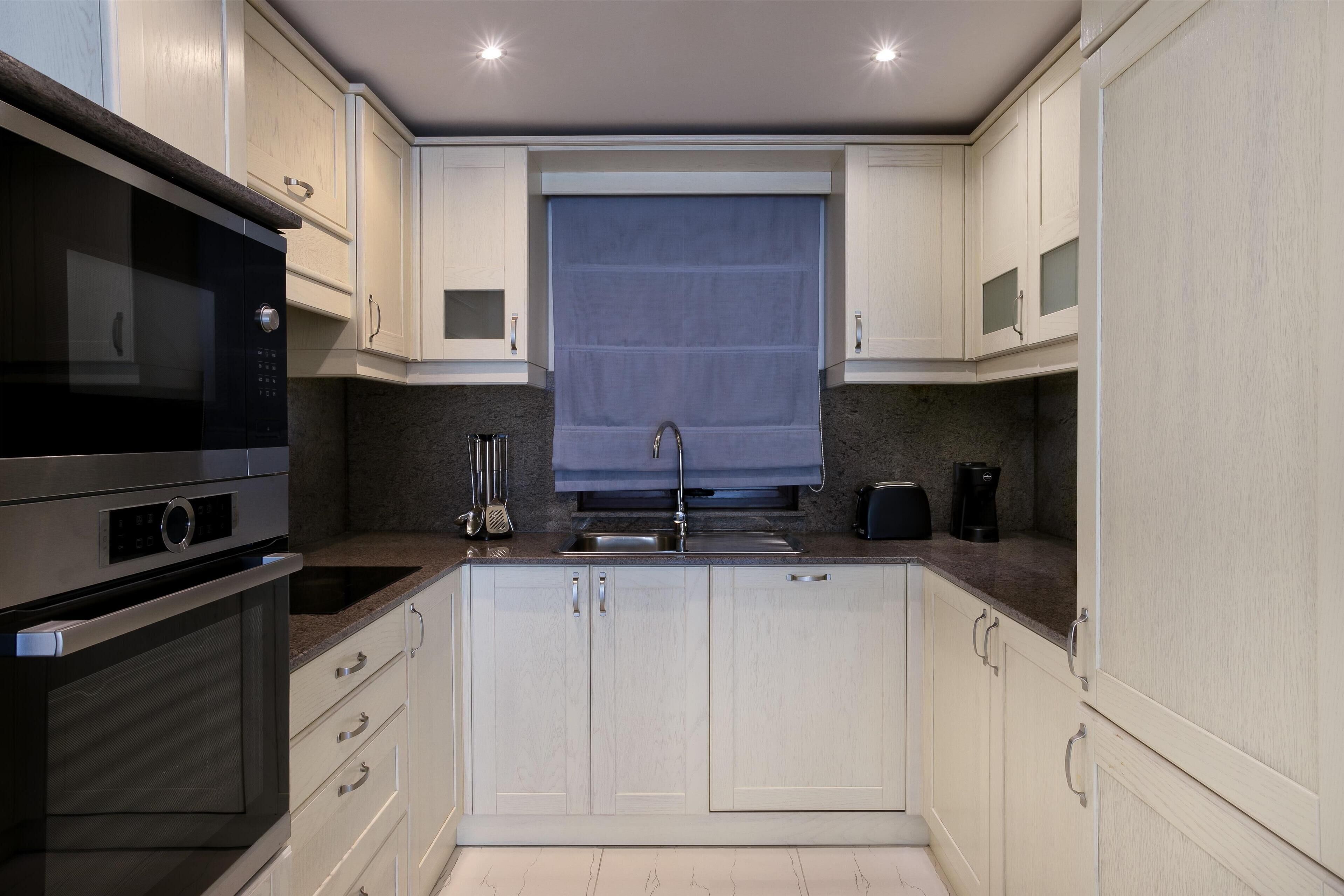 luxury apartment, 1 bedroom, pool view | private kitchen | coffee/tea maker, electric kettle, eco-friendly cleaning products