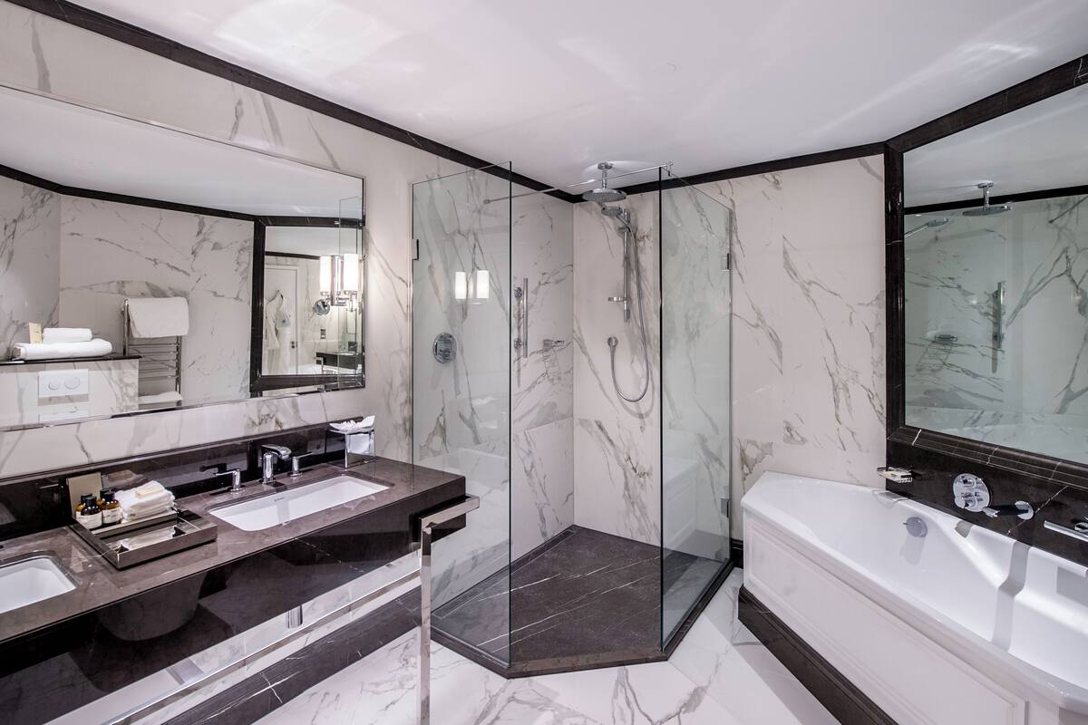 designer toiletries, hair dryer, bathrobes, towels