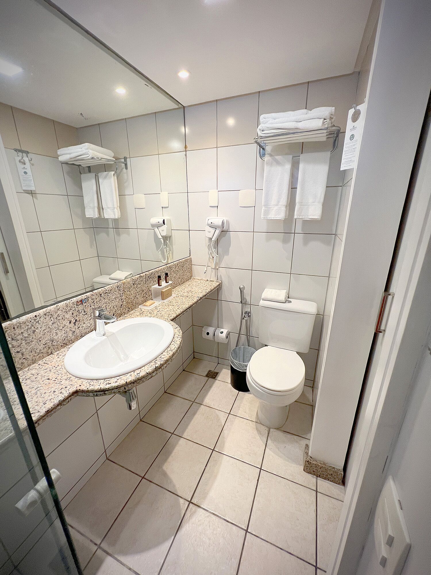 family apartment | bathroom | designer toiletries, hair dryer, towels, soap