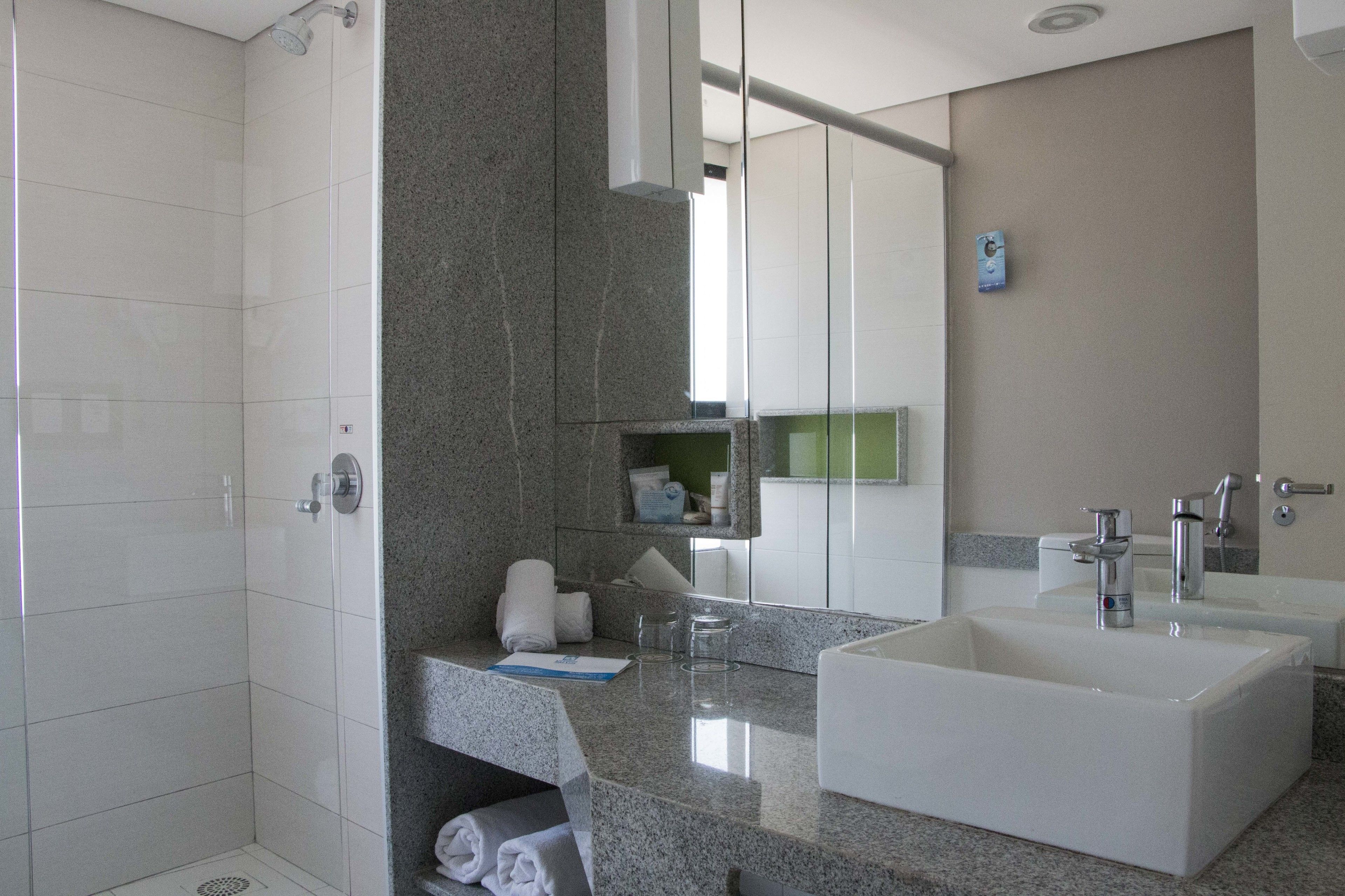 designer toiletries, hair dryer, towels, soap