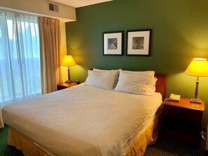 Premium bedding, desk, laptop workspace, blackout curtains
