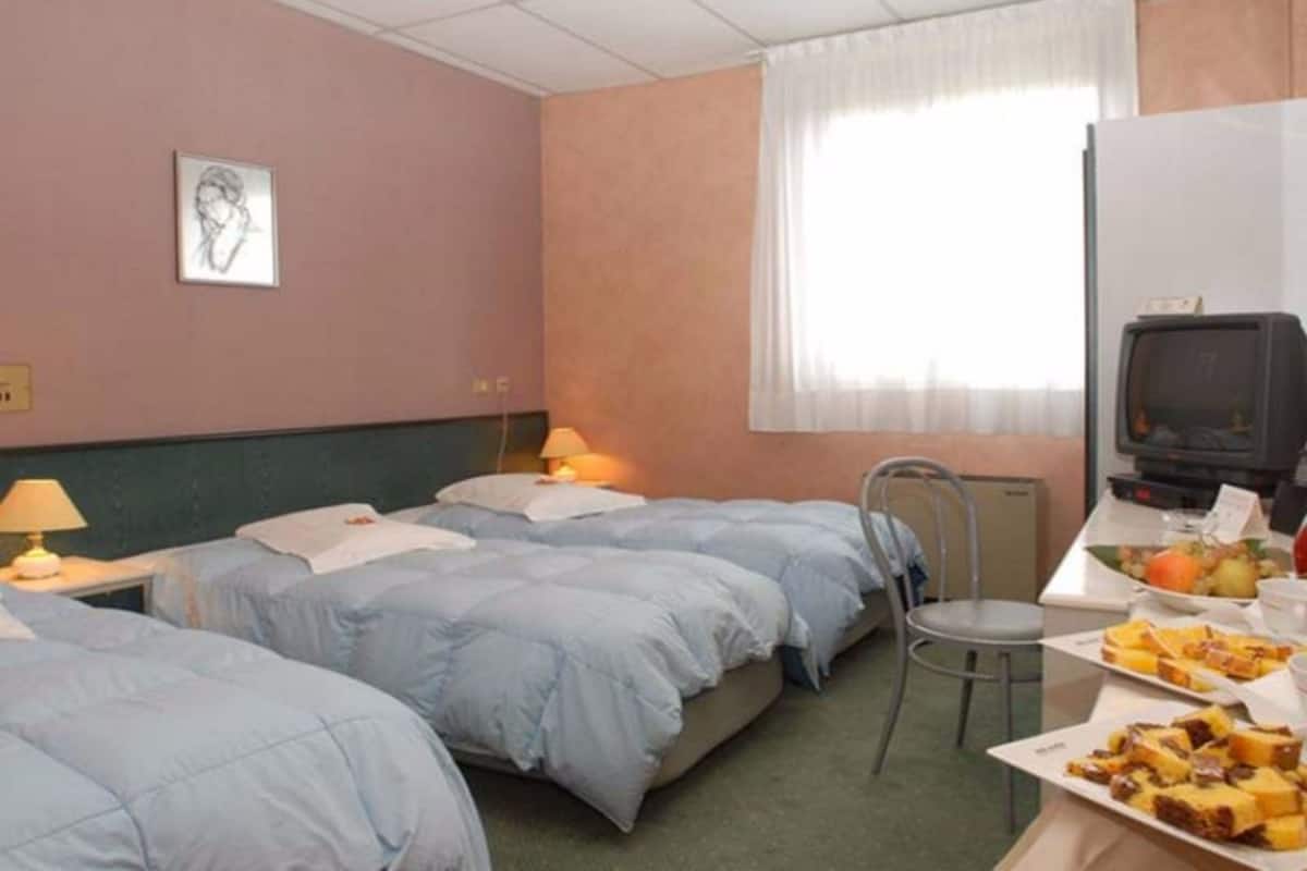 Triple Room | Desk, soundproofing, iron/ironing board (on request), cribs (surcharge)