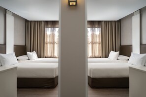 A mirrored hotel room with two beds, a nightstand, and a large window with curtains. - Protea Hotel by Marriott Cape Town Waterfront Breakwater Lodge (Cape Town)