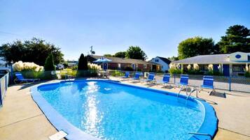 Seasonal outdoor pool, open 9:00 AM to 9:00 PM, pool umbrellas