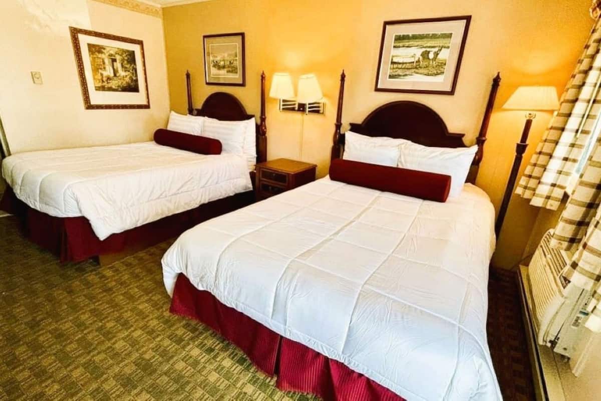 Pillowtop beds, desk, blackout drapes, iron/ironing board