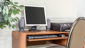 A wooden desk with a computer, keyboard, mouse, and printer. - Econo Lodge Inn & Suites Marietta near Dobbins ARB (Marietta)