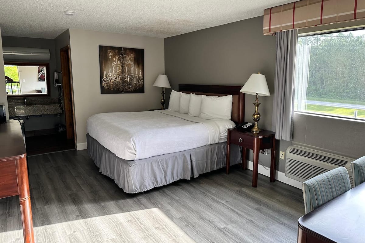 Minibar, desk, blackout curtains, iron/ironing board