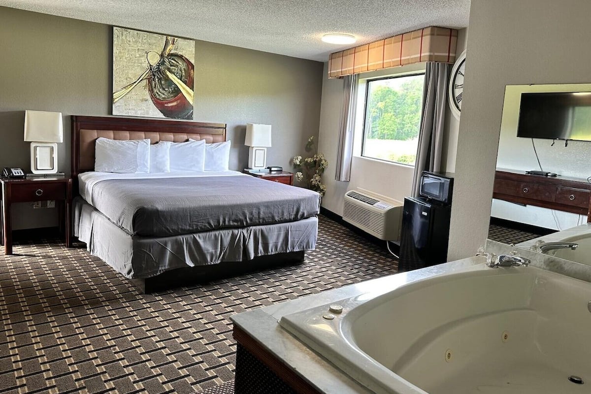 Minibar, desk, blackout curtains, iron/ironing board