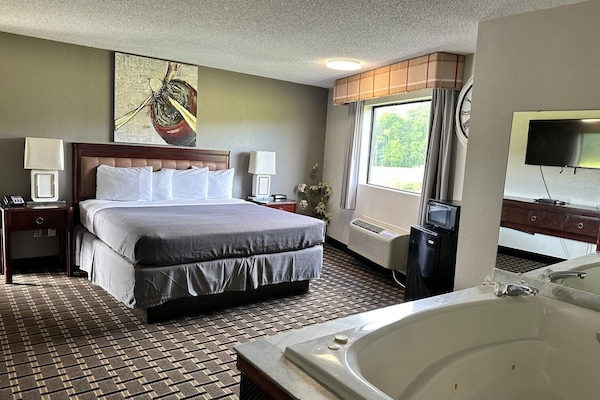Honeymoon Single Room | Minibar, desk, blackout drapes, iron/ironing board