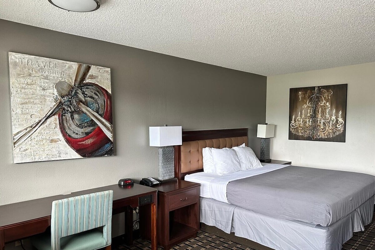Minibar, desk, blackout curtains, iron/ironing board