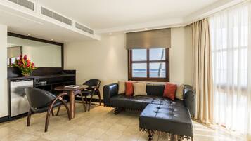 Suite, Ocean View | Living area | 32-inch LCD TV with satellite channels, TV