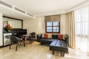 Suite, Ocean View | Living area | 32-inch LCD TV with satellite channels, TV