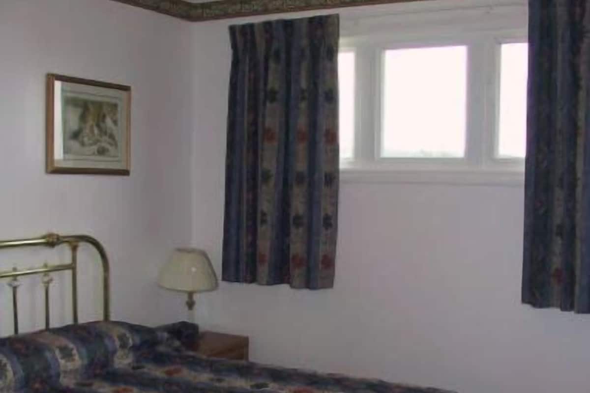 Apartamento superior, 3 quartos | Vista do quarto