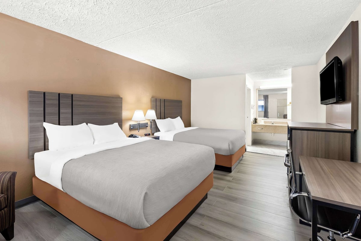 Premium bedding, pillow-top beds, desk, blackout curtains