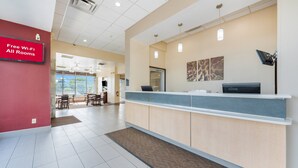 A reception area with a sign indicating free Wi-Fi in all rooms.
