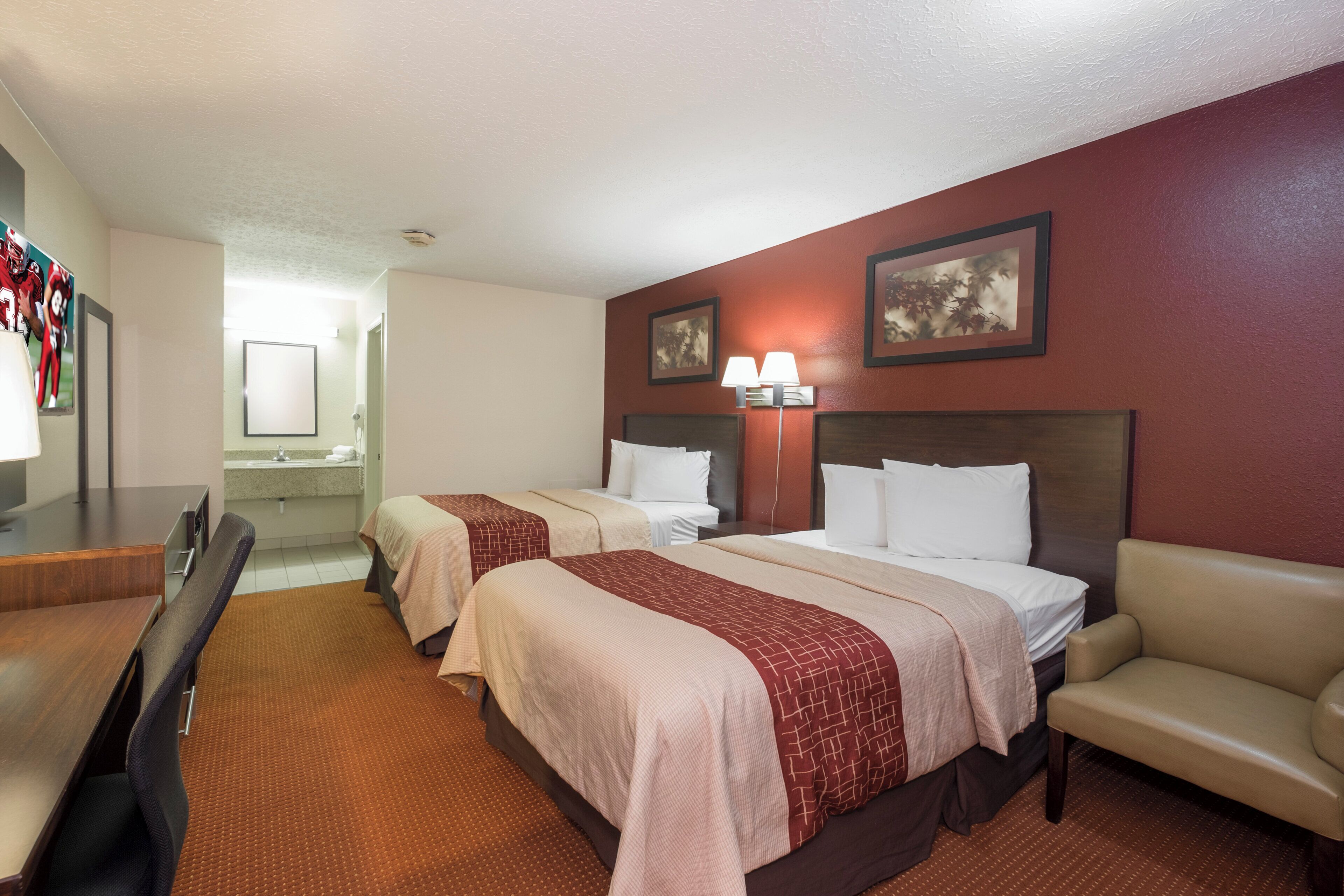 Deluxe Room, 2 Queen Beds, Non Smoking | Desk, laptop workspace, blackout drapes, iron/ironing board