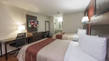 Deluxe Room, 2 Queen Beds, Non Smoking | Desk, laptop workspace, blackout drapes, iron/ironing board