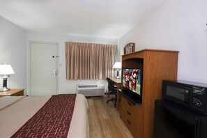 Desk, laptop workspace, blackout drapes, iron/ironing board