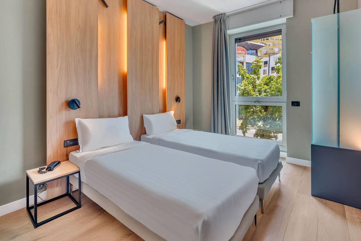 Standard Twin Room | Down comforters, minibar, in-room safe, desk