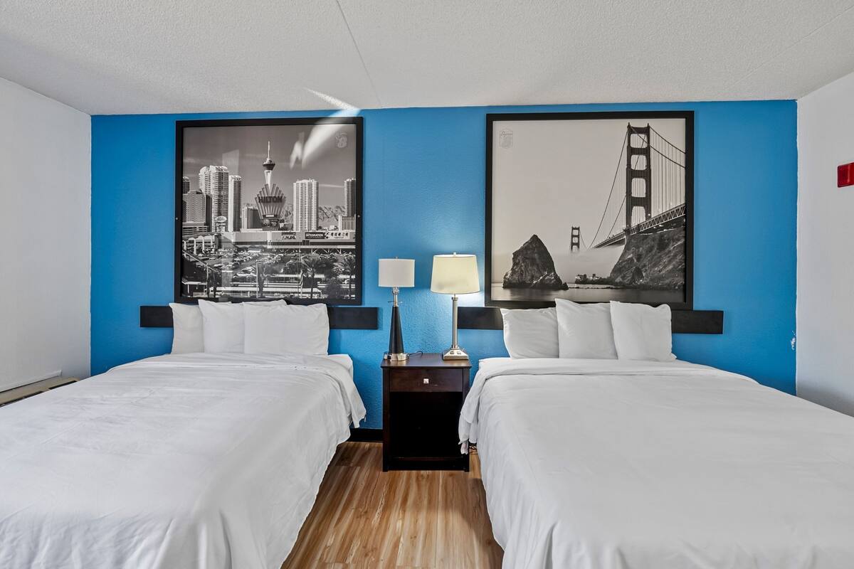 Deluxe Room, 2 Queen Beds, Non Smoking | Desk, laptop workspace, blackout drapes, iron/ironing board