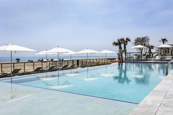 Indoor pool, outdoor pool, open 7:00 AM to 11:00 PM, pool umbrellas