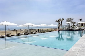 Indoor pool, outdoor pool, open 7:00 AM to 11:00 PM, pool umbrellas