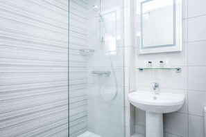 Shower, free toiletries, hair dryer, towels