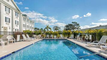 Outdoor pool, open 7:00 AM to 7:00 PM, pool umbrellas, pool loungers