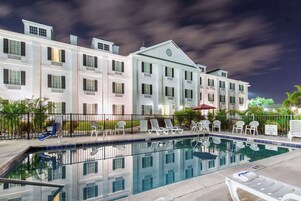 Outdoor pool, open 7:00 AM to 7:00 PM, pool umbrellas, sun loungers