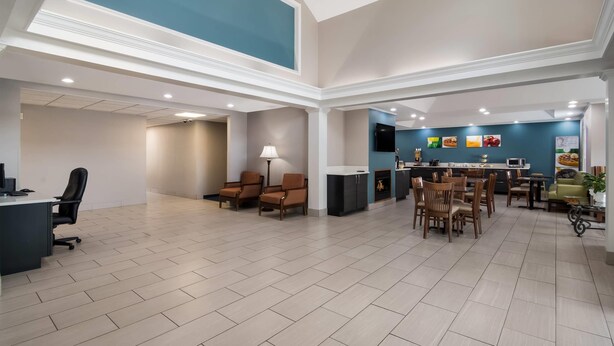 A spacious interior with a high ceiling, a dining area, and a kitchen. - Quality Inn Goldsboro (Goldsboro)