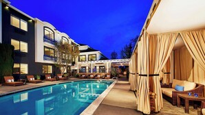A swimming pool with lounge chairs and a covered seating area. - Aloft by Marriott San Jose Cupertino (San Jose)